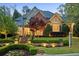 Luxurious home featuring brick and siding exterior, manicured landscaping, and stone stairs at 1319 Glen Cedars Dr, Smyrna, GA 30126