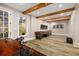 Spacious game room with exposed beams, ample natural light, and entertaining space at 1319 Glen Cedars Dr, Smyrna, GA 30126