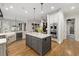 Modern kitchen with an island, stainless steel appliances, and hardwood flooring at 1319 Glen Cedars Dr, Smyrna, GA 30126