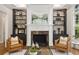 Cozy living room with a fireplace, built-in bookshelves, and comfortable seating at 1319 Glen Cedars Dr, Smyrna, GA 30126