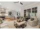 Open concept living space with hardwood floors, neutral tones, and large windows overlooking the backyard at 1319 Glen Cedars Dr, Smyrna, GA 30126