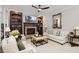 Cozy living room features a stone fireplace, built-in shelving, and plush seating at 1319 Glen Cedars Dr, Smyrna, GA 30126