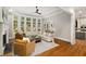 Bright living room with hardwood floors, a fireplace, and large windows overlooking the yard at 1319 Glen Cedars Dr, Smyrna, GA 30126