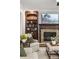 A stone fireplace and built-in shelving are the highlights of this cozy living room at 1319 Glen Cedars Dr, Smyrna, GA 30126