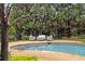 Lounge by the pool with stone and lush landscaping at 1319 Glen Cedars Dr, Smyrna, GA 30126