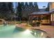 Beautiful backyard featuring a gazebo, outdoor kitchen, and refreshing swimming pool at 1319 Glen Cedars Dr, Smyrna, GA 30126