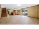Finished basement with tile floors, wood paneled walls, and a bar area for entertaining at 1478 Biltmore Ne Dr, Atlanta, GA 30329