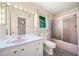 Cozy bathroom featuring vintage style with patterned wallpaper, window, and a shower stall at 1478 Biltmore Ne Dr, Atlanta, GA 30329