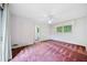 Spacious bedroom with neutral walls, large window and a ceiling fan for added comfort at 1478 Biltmore Ne Dr, Atlanta, GA 30329