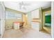 Bright bedroom with a built-in desk, cabinets, and a ceiling fan providing a functional workspace at 1478 Biltmore Ne Dr, Atlanta, GA 30329