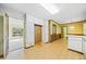Kitchen with white cabinets, a vintage eating area, and access to a room with lots of natural light at 1478 Biltmore Ne Dr, Atlanta, GA 30329