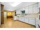 Functional kitchen with white cabinets, ample counter space, and a retro-style eating area adjacent at 1478 Biltmore Ne Dr, Atlanta, GA 30329