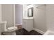 Bathroom with vanity and mirror, a tiled shower/tub, and black honeycomb tile flooring at 870 Gaston Sw St, Atlanta, GA 30310