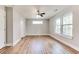 Bright bedroom with light wood floors, a ceiling fan, and sun-drenched windows at 870 Gaston Sw St, Atlanta, GA 30310