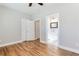 Bedroom featuring hardwood floors, neutral paint, an ensuite bathroom, and closet at 870 Gaston Sw St, Atlanta, GA 30310