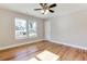 Bright bedroom with hardwood floors, ceiling fan and double windows letting in natural light at 870 Gaston Sw St, Atlanta, GA 30310