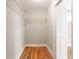 Walk-in closet with wire shelving, hardwood floors and ample storage space at 870 Gaston Sw St, Atlanta, GA 30310