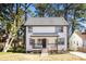 Charming two-story home with a welcoming front porch and beautifully maintained landscaping at 870 Gaston Sw St, Atlanta, GA 30310
