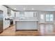 Modern white kitchen with stainless steel appliances, quartz countertops, and a large island at 870 Gaston Sw St, Atlanta, GA 30310