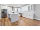 Contemporary kitchen with white cabinetry, stainless steel appliances, and a spacious island at 870 Gaston Sw St, Atlanta, GA 30310