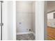Laundry room featuring patterned tile floors, a wire rack, and utility connections at 870 Gaston Sw St, Atlanta, GA 30310