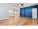 Open-concept living space connects to a modern kitchen, featuring new hardwood floors at 870 Gaston Sw St, Atlanta, GA 30310