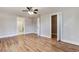 Open Primary bedroom with ensuite bathroom and walk-in closet featuring hardwood floors at 870 Gaston Sw St, Atlanta, GA 30310