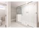 Modern bathroom with a large walk-in shower, herringbone tile floor and a toilet at 870 Gaston Sw St, Atlanta, GA 30310