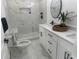 Bright bathroom featuring a walk-in shower, double vanity, and modern fixtures at 1841 Bayberry Sw Dr, Atlanta, GA 30311