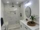 Modern bathroom features a marble-tiled shower with dual shower heads and a sleek vanity at 1841 Bayberry Sw Dr, Atlanta, GA 30311