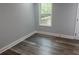 Bright bedroom with hardwood floors and a window showcasing natural light and outdoors at 1841 Bayberry Sw Dr, Atlanta, GA 30311