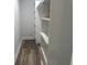 Walk-in closet with wood-look flooring and a customizable shelving system for optimal storage at 1841 Bayberry Sw Dr, Atlanta, GA 30311