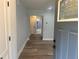 Inviting entryway with wood-look flooring and a view into the modern, bright bathroom at 1841 Bayberry Sw Dr, Atlanta, GA 30311
