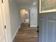 Inviting entryway with wood-look flooring and a view into the modern, bright bathroom at 1841 Bayberry Sw Dr, Atlanta, GA 30311