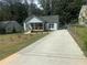 Charming renovated home with a covered front porch and a long driveway at 1841 Bayberry Sw Dr, Atlanta, GA 30311