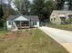 Renovated cottage home features a welcoming porch and manicured front lawn at 1841 Bayberry Sw Dr, Atlanta, GA 30311