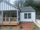 Charming craftsman home features a covered porch with a ceiling fan and a manicured lawn at 1841 Bayberry Sw Dr, Atlanta, GA 30311