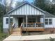 Charming house features a new porch with wooden railings and a freshly painted exterior at 1841 Bayberry Sw Dr, Atlanta, GA 30311
