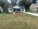 Charming renovated bungalow with new gray siding, a inviting front porch, and freshly landscaped front yard at 1841 Bayberry Sw Dr, Atlanta, GA 30311
