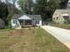 Charming home with a well-maintained front yard and driveway at 1841 Bayberry Sw Dr, Atlanta, GA 30311