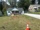 Charming renovated bungalow with a welcoming front porch and freshly seeded front yard at 1841 Bayberry Sw Dr, Atlanta, GA 30311
