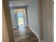 View of the entry hallway, with a sidelight window and wood-look flooring at 1841 Bayberry Sw Dr, Atlanta, GA 30311