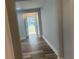 View of the entry hallway, with a sidelight window and wood-look flooring at 1841 Bayberry Sw Dr, Atlanta, GA 30311