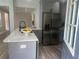 Beautifully renovated kitchen with gray cabinets, a large island, and modern stainless steel appliances at 1841 Bayberry Sw Dr, Atlanta, GA 30311