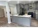 Modern kitchen with gray cabinets, stainless steel appliances, and white quartz countertops at 1841 Bayberry Sw Dr, Atlanta, GA 30311
