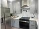 Modern kitchen boasts gray cabinets, stainless steel appliances, and sleek quartz countertops at 1841 Bayberry Sw Dr, Atlanta, GA 30311