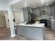 Modern kitchen with gray cabinets, stainless steel appliances, and white quartz countertops at 1841 Bayberry Sw Dr, Atlanta, GA 30311