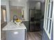 Modern kitchen boasts stainless steel appliances, quartz countertops, and a stylish island with seating at 1841 Bayberry Sw Dr, Atlanta, GA 30311