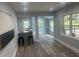 Bright open-concept area with wood flooring, opening to a kitchen and dining area with lots of natural light at 1841 Bayberry Sw Dr, Atlanta, GA 30311