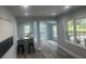 Open concept living space with sleek floors and natural light at 1841 Bayberry Sw Dr, Atlanta, GA 30311
